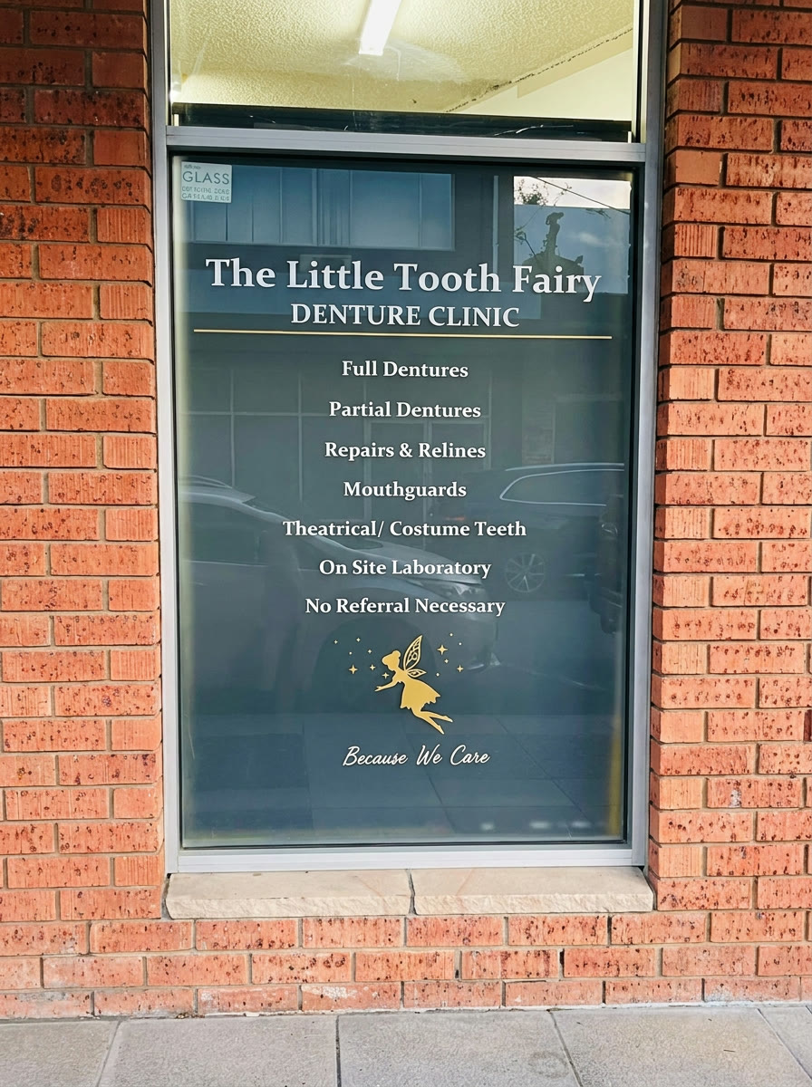 The clinic's front window listing its services